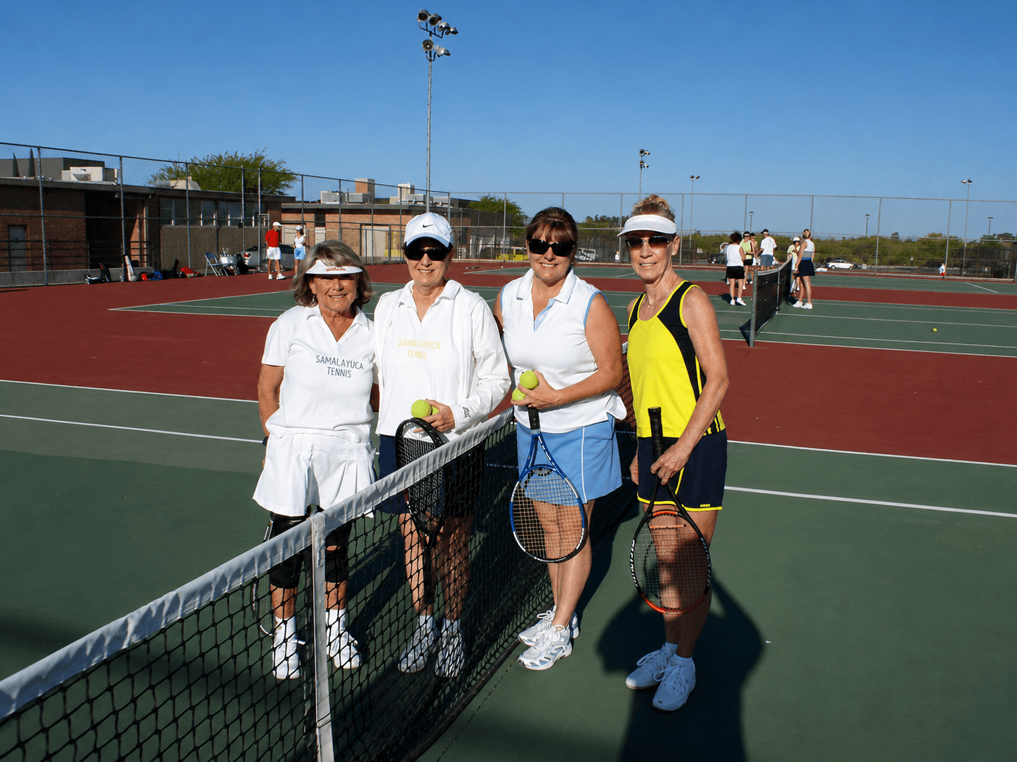 Clinic players at the net
