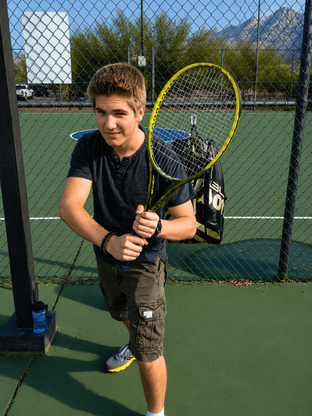 Competitive junior tennis player on court